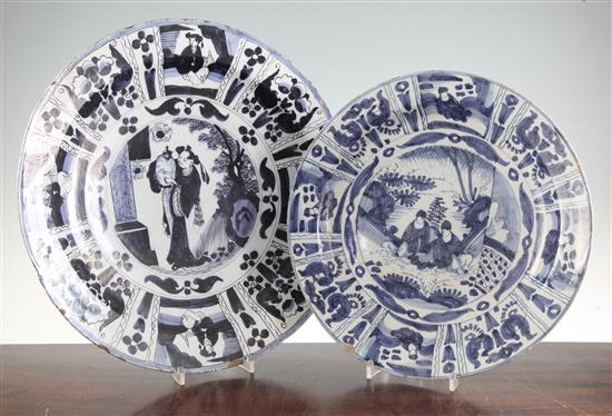 Two Dutch Delft blue and white chargers, c.1690-1700, 34cm and 39.5cm, some damage